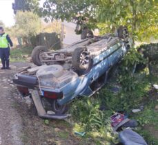 Bursa'da kaza yapan sürücü devrilen otomobilinin yanında gözyaşı döktü